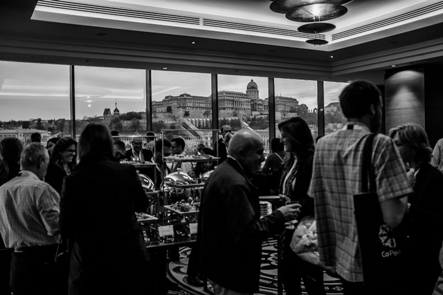 Delegates at an evening reception overlooking the city